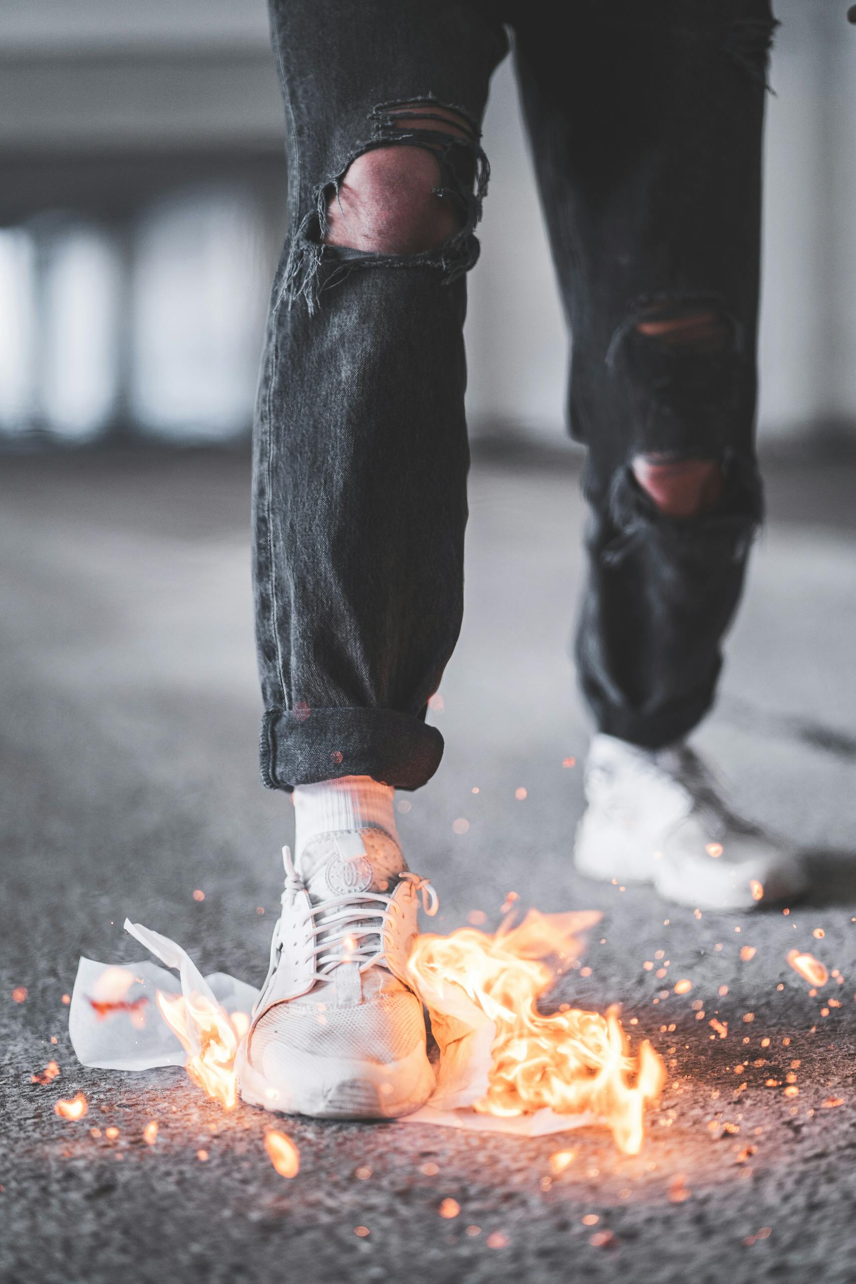 Home Stylish sneakers ignited in flames highlight urban fashion and daring style.